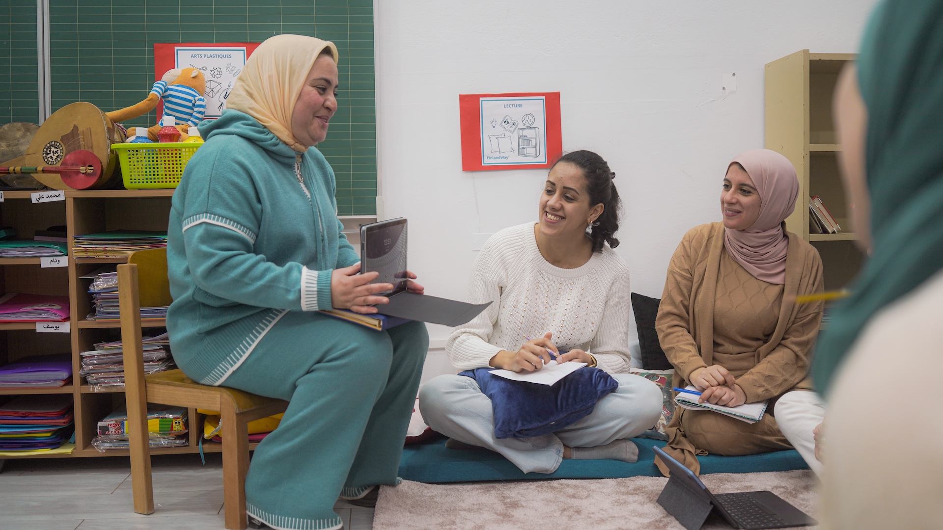 Parents and educators interacting during a school event, highlighting family engagement in early childhood education