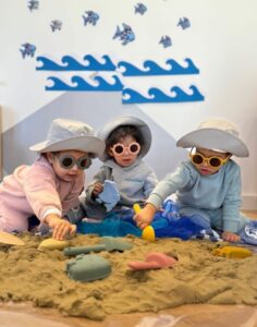 Children exploring the phenomenon of the beach