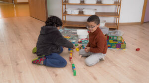 Children sorting blocks  and making patterns at preschool.