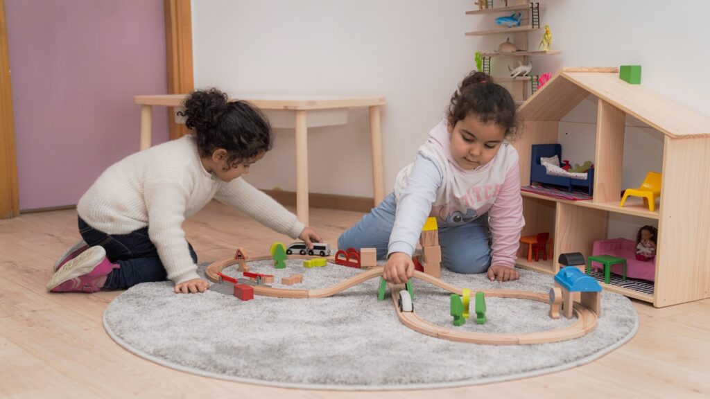Children playing with train track