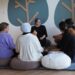 FinlandWay trainer sitting on the floor with teacher trainees in Kuwait