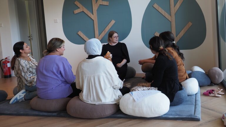 FinlandWay trainer sitting on the floor with teacher trainees in Kuwait