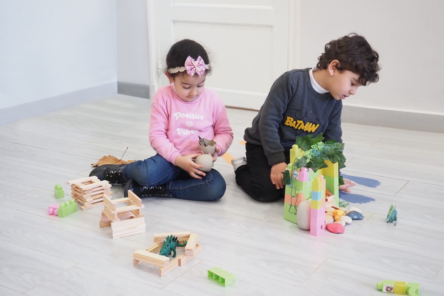 Preschoolers learning problem-solving through play-based curriculum.
