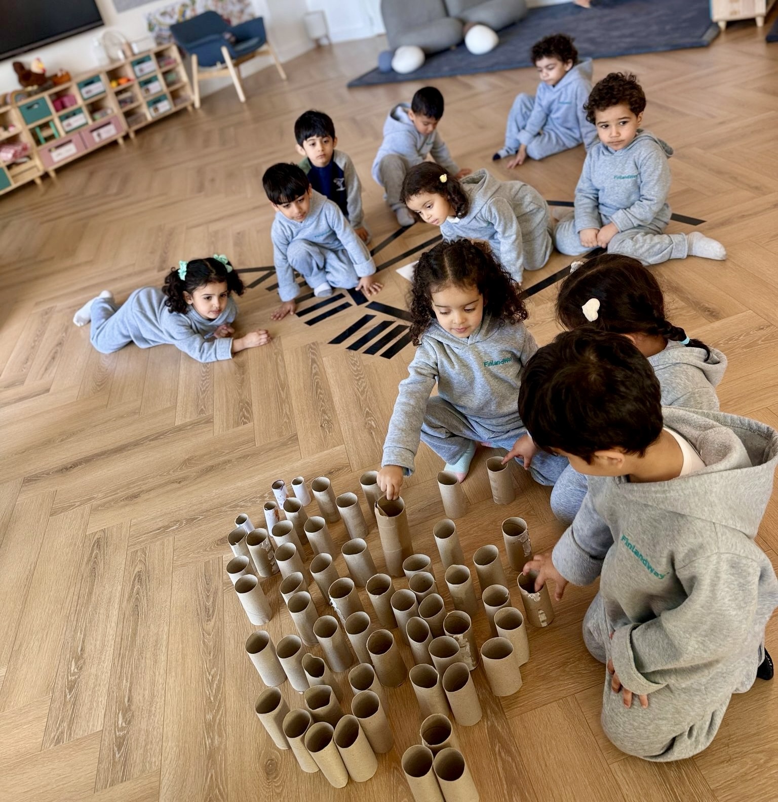 Children engaged in Finland-model play-based learning showing social and cognitive development