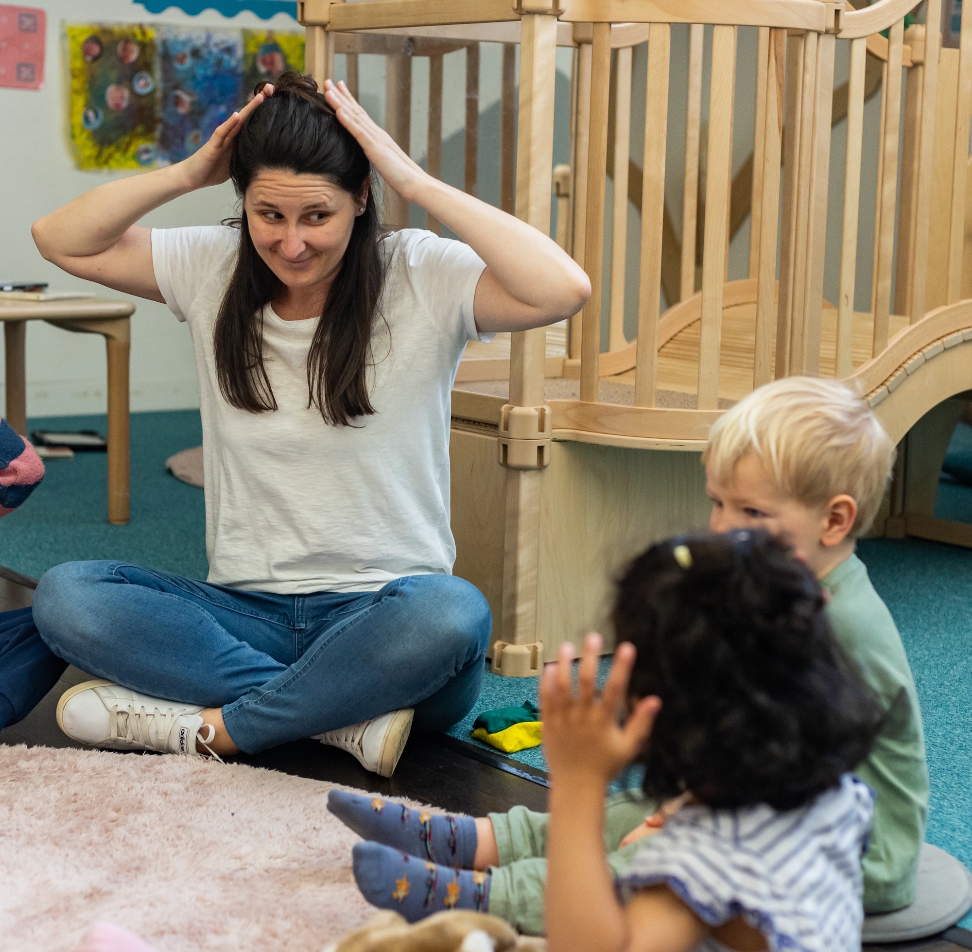 FinlandWay® Finland model teacher engaged with a child in an early years learning environment