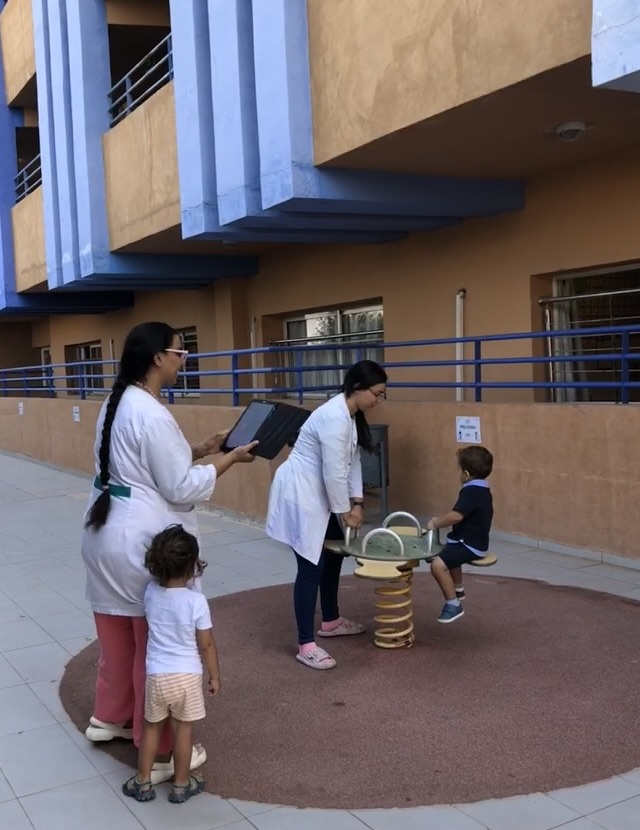 Teacher using tablet to document children's learning in a FinlandWay® early years classroom